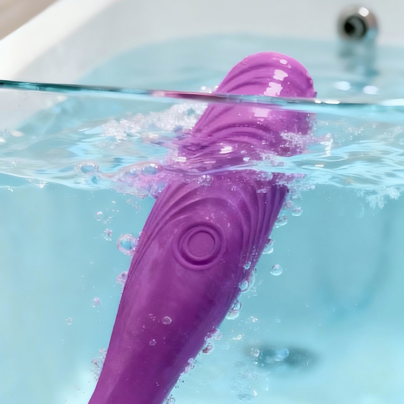 Inviting scene of the vibtator underwater in a bath, showcasing its IPX7 rating for worry-free aquatic pleasure.