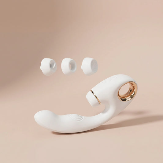 Close-up of the interchangeable suction heads for the white massager, showing options for different sensations.
