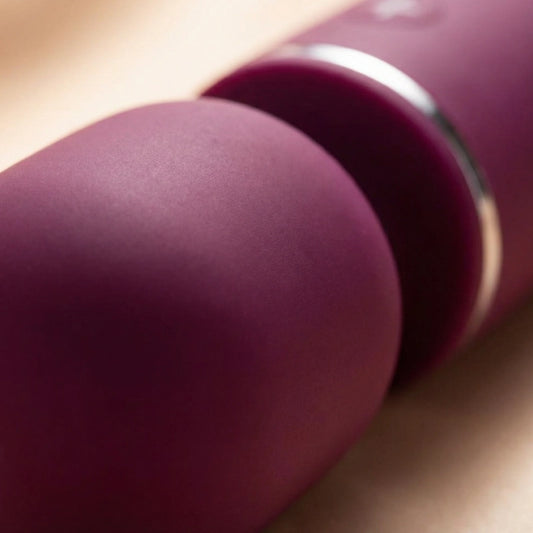 Close-up of the ultra-soft silicone massage head demonstrating its flexible, skin-like texture.