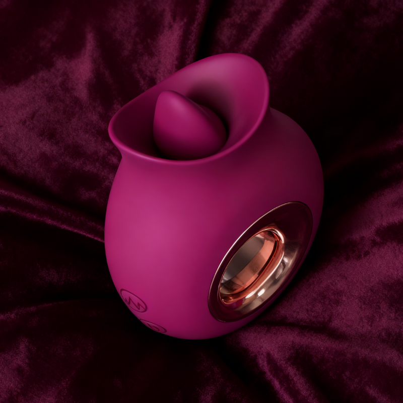 A deep wine-red, silicone personal massager with a realistic tongue shape, shown on a neutral background