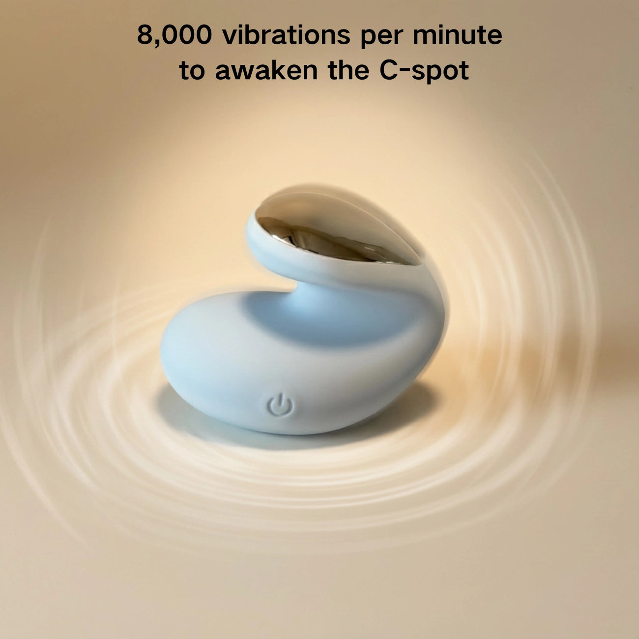 The device on a warm neutral background with subtle ripple effects symbolizing 8,000 vibrations per minute