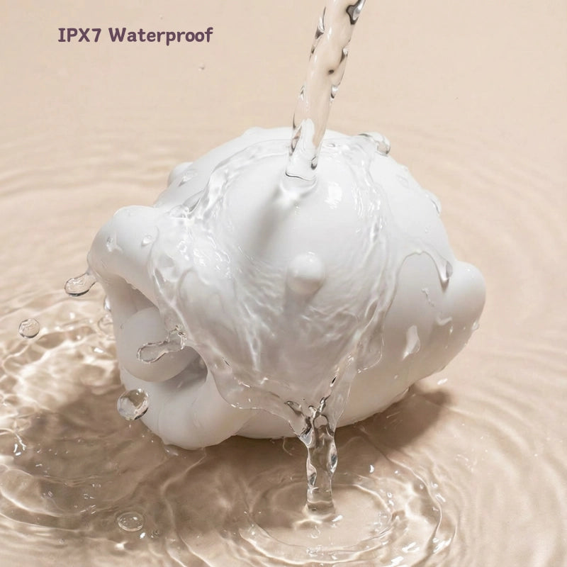 fish vibrator being rinsed under running water, water droplets on silicone surface, hygienic and fully waterproof