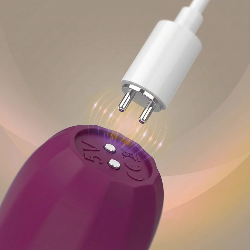 Magnetic charging connector attached to the base of the massager for quick and cable-free charging.