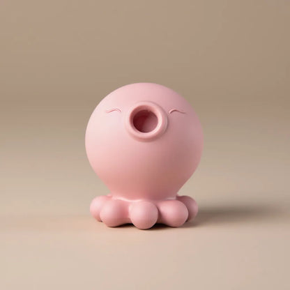 High-definition front view of pink octopus suction vibrator on neutral background, female pleasure toy with clitoral suction and multi-speed vibration, sexual wellness product for self-pleasure and stress relief.