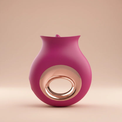 closed up burgundy gold product on a beige background