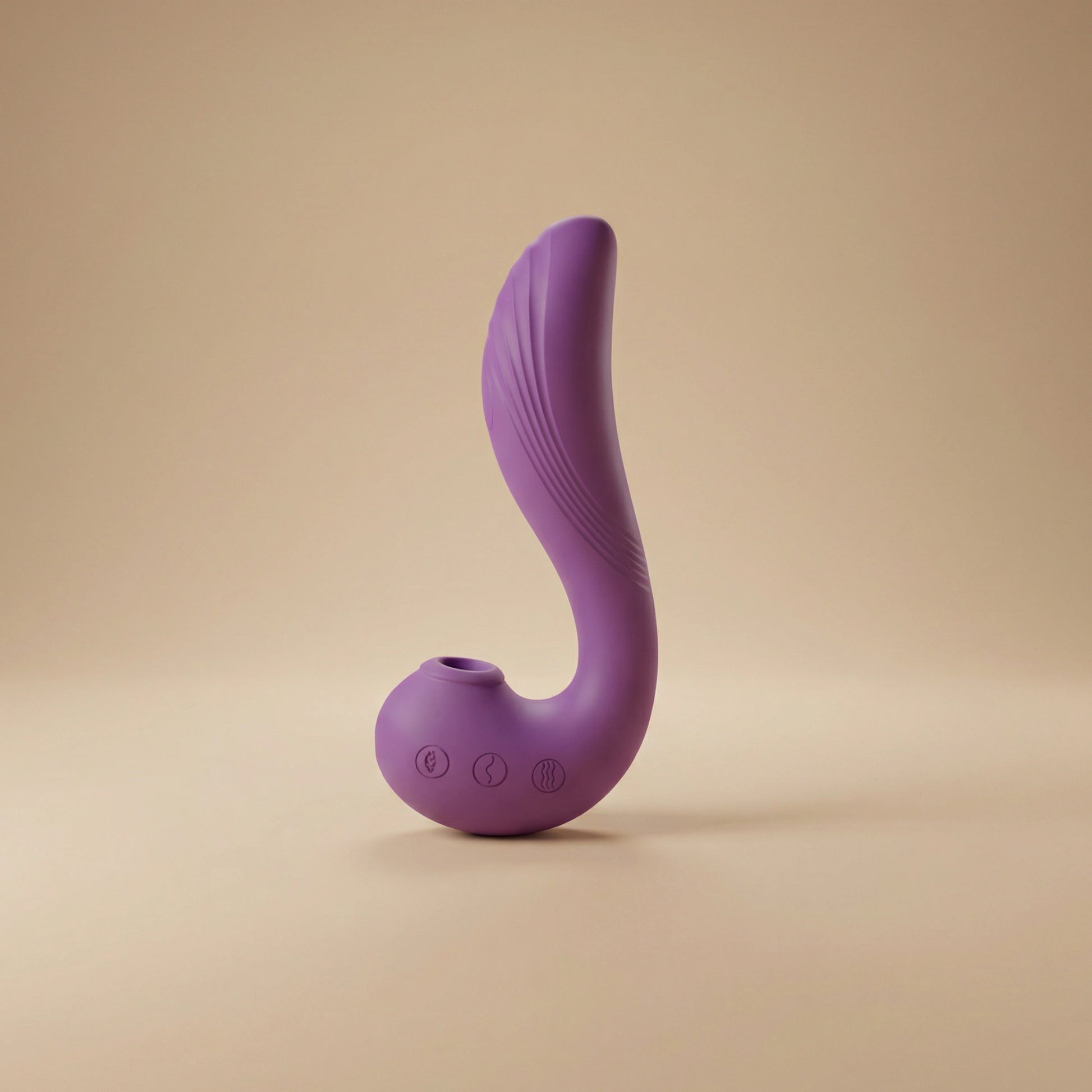 Purple silicone butt plug on a beige background