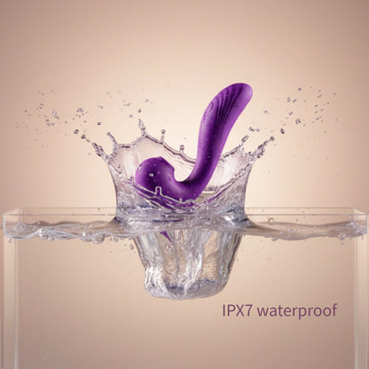 Purple Wings wellness device shown with realistic water splashes and droplets against a violet-to-lilac gradient background, illustrating its IPX7 waterproof capabilities.