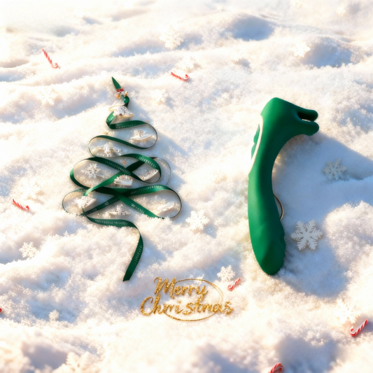 Forest green holiday vibrator beside a festive ribbon tree, a perfect discreet and elegant Christmas gift for her.