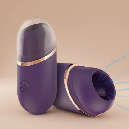 Front and top-side view of the lipstick stimulator in a new indigo color, showcasing its sleek finish and compact design from multiple angles. Features a protective safety cap and a travel-friendly design for ultimate discretion and hygiene on the go.
