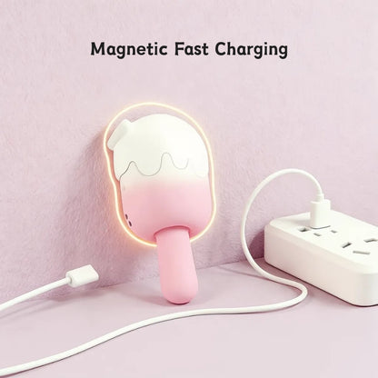 The ice cream pleasure toy shown with its magnetic charging cable seamlessly attached, enabling fast, safe, and convenient cordless charging.