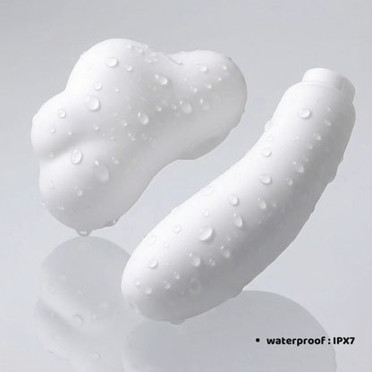 Lifestyle image showing the two modular components of the mushroom-cloud-shaped pleasure product separated and resting on a clean surface. The text "WATERPROOF: IPX7" is clearly visible, highlighting that both the suction stimulator and the vibrating base are fully submersible for easy cleaning and versatile use in the bath or shower.
