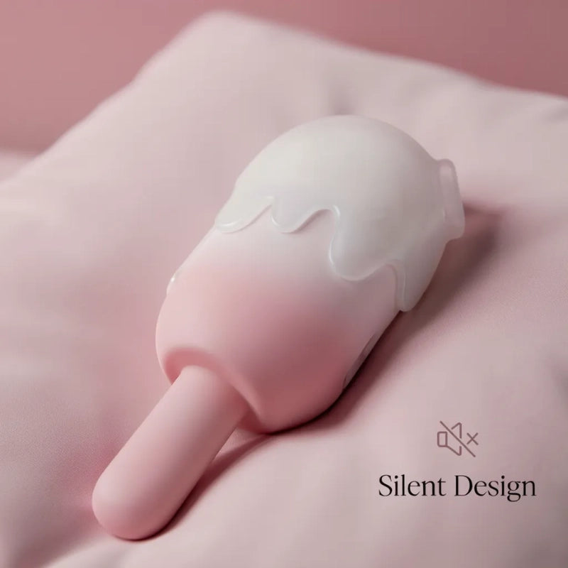 Side view of the pink ombre ice cream toy resting on a soft pillow, showcasing its silent design for private and undisturbed moments in the bedroom.